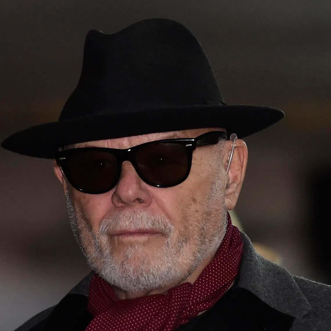 British former pop star Gary Glitter, whose real name is Paul Gadd, leaves Southwark Crown Court in London February 4, 2015. The jury has retired to consider its verdict in Glitter's trial on charges of sexual offences involving underage girls. REUTERS/Toby Melville