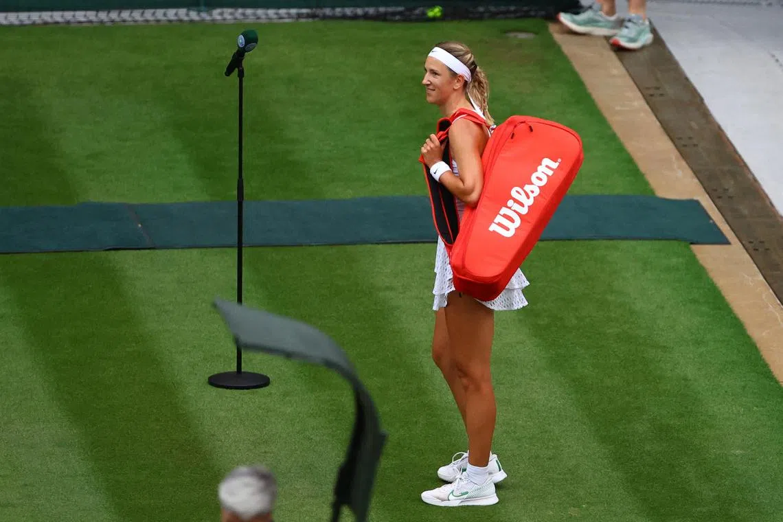 Belarus' Victoria Azarenka reacting to spectators as she leaves the court after losing her Wimbledon fourth round match against Ukraine's Elina Svitolina on Sunday. Azarenka was booed off court for failing to offer Svitolina an obligatory handshake.