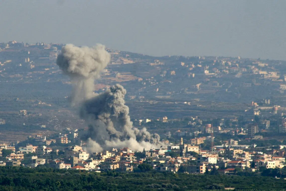 Smoke billows after an Israeli strike on villages near the southern Lebanese city of Tyre on Sept 29.