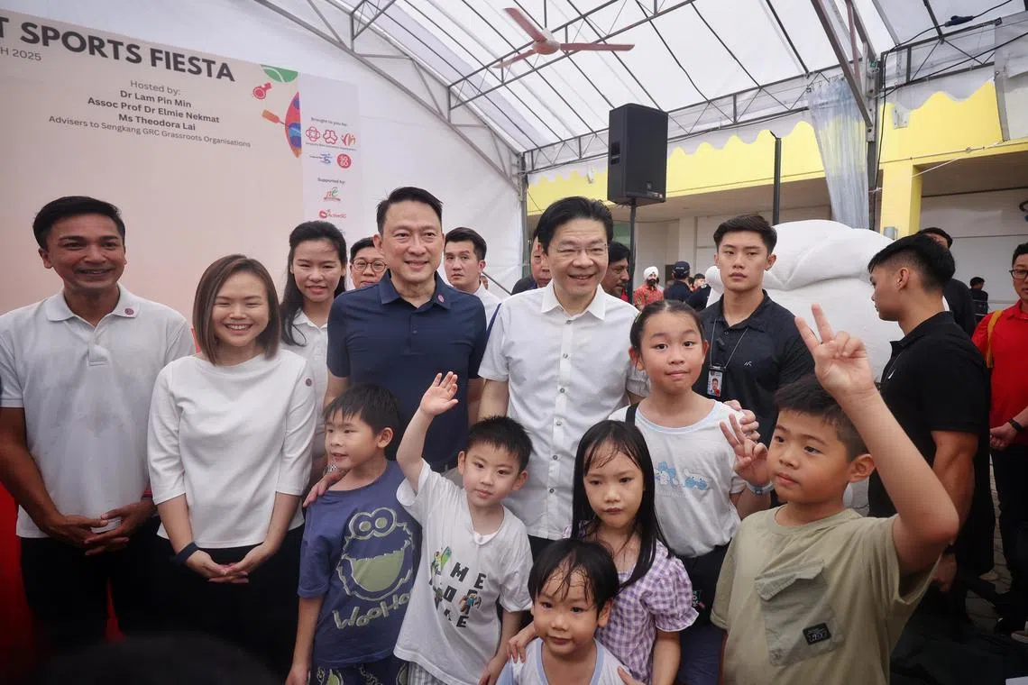 ST20250316_202588600871/yfsengkang16/Yufeng/Jason Quah

Prime Minister Lawrence Wong, accompanied by (from left) Associate Professor Elmie Nekmat, Ms Theodora Lai, Ms Bernadette Giam and Dr Lam Pin Min, posing for photos with residents at the Sengkang West Sports and Family Fiesta at Anchorvale Community Club on March 16, 2025. ST PHOTO: JASON QUAH