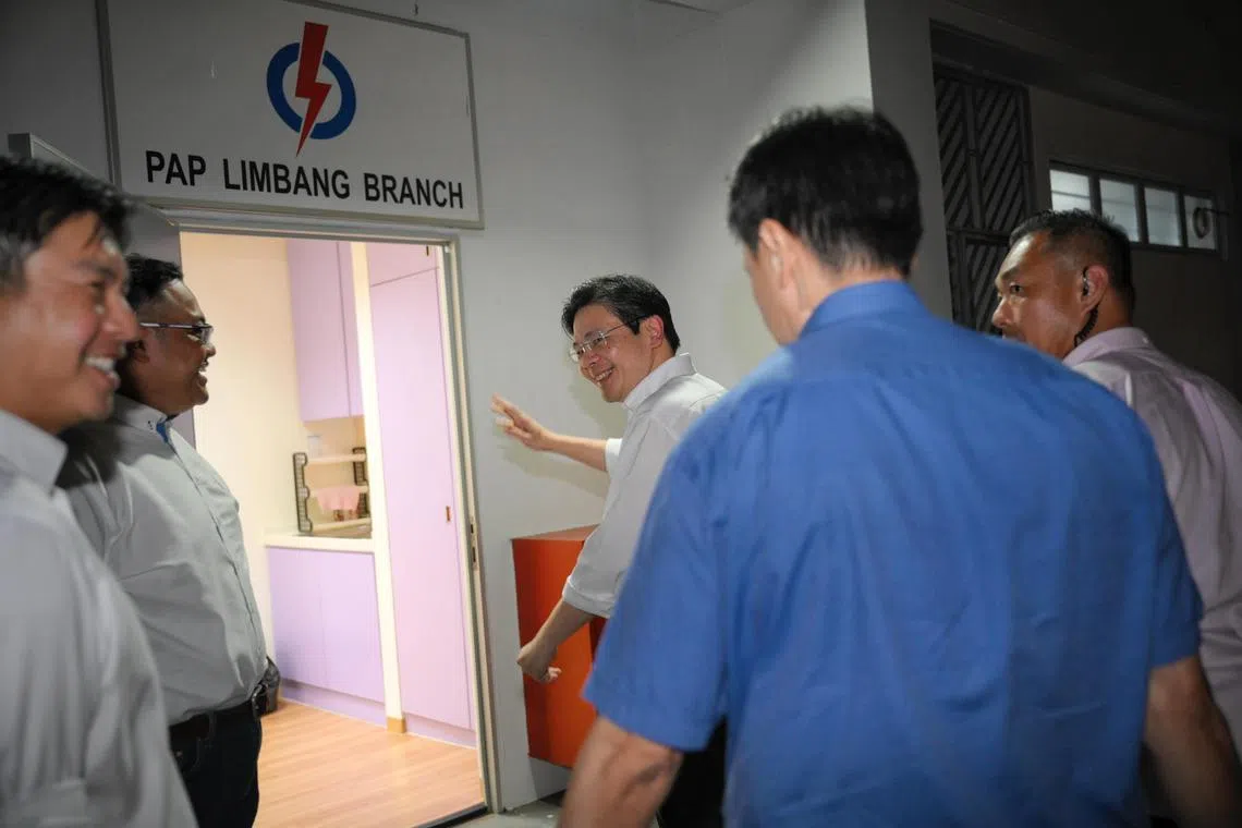Deputy Prime Minister Lawrence Wong waves as he arrives at the PAP Limbang Branch for a Meet-the-People session at Block 787 Choa Chu Kang North 6 on April 15, 2024.
