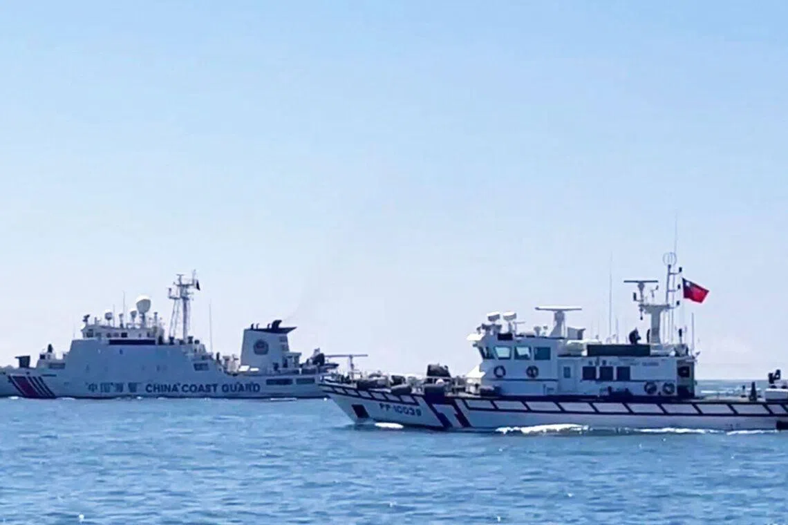 A Taiwan Coast Guard patrol vessel sailing near a China Coast Guard ship in the waters south of Kinmen, Taiwan.