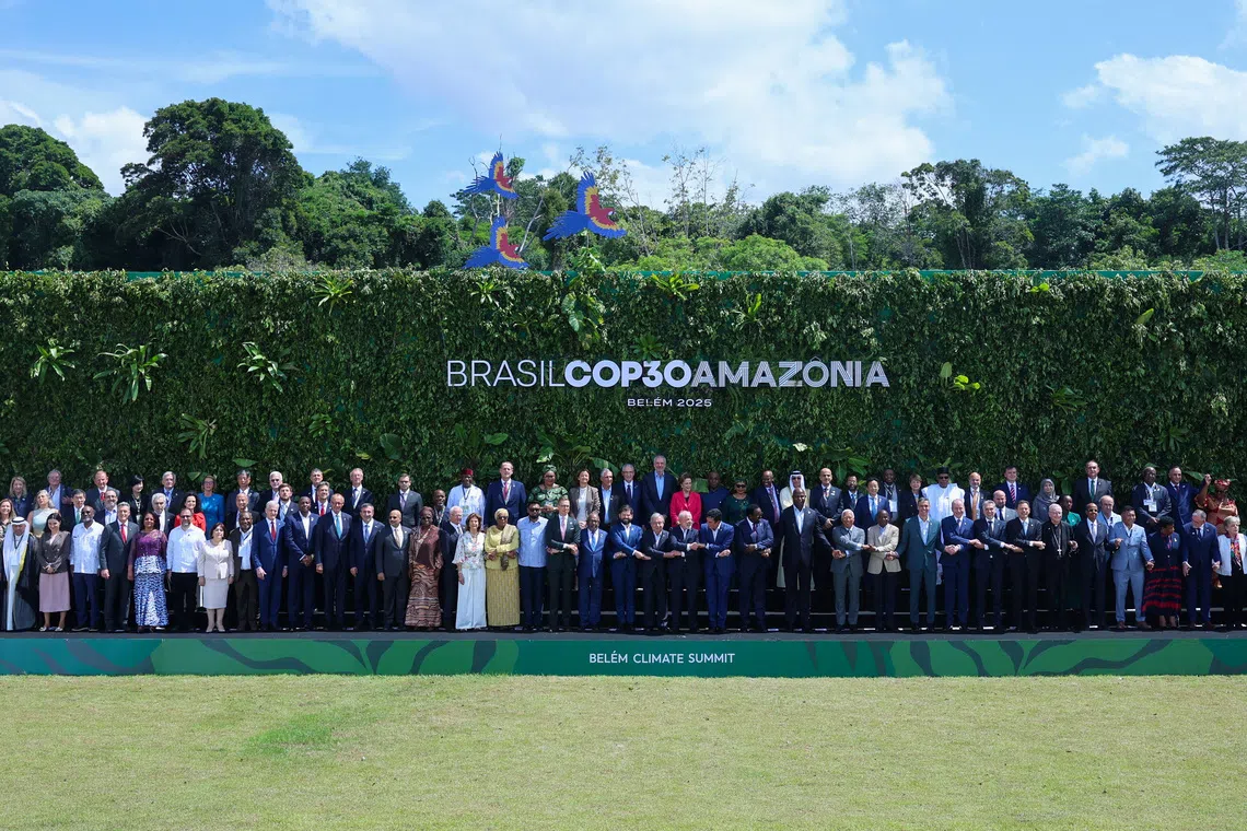 Brazil's President Luiz Inacio Lula da Silva, United Nations Secretary-General Antonio Guterres and other delegates attending the Belem Climate Summit ahead of the United Nations Climate Change Conference (COP30) pose for a family photo, in Belem, Brazil, November 7, 2025. REUTERS/Adriano Machado