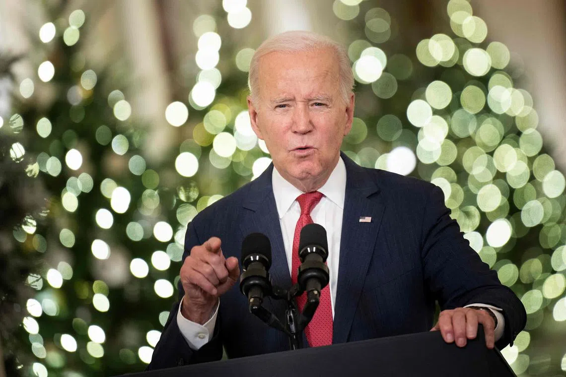 US President Joe Biden delivers a Christmas address from the Cross Hall of the White House in Washington DC.