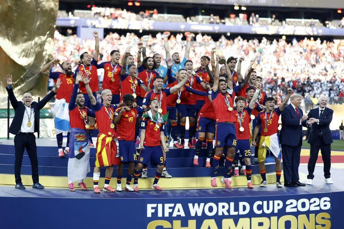 US President Donald Trump and FIFA president Gianni Infantino (far right) on stage as Spain captain Rodri hoists the World Cup trophy on July 19.