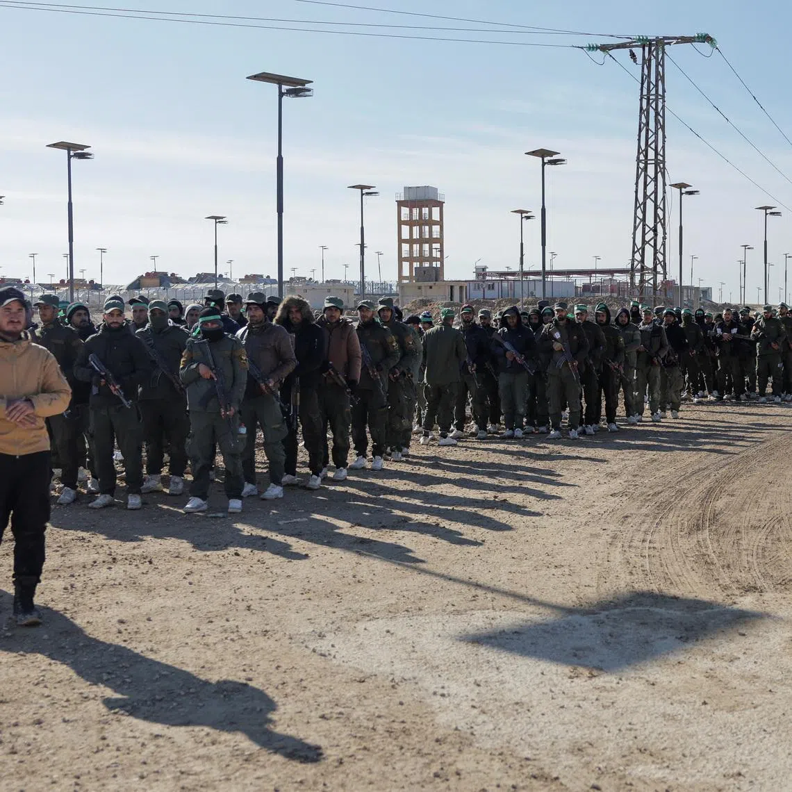 Members of the Syrian government security forces gather after they took control of al-Hol camp following the withdrawal of Syrian Democratic Forces (SDF), in Hasaka, Syria, January 21, 2026. REUTERS/Khalil Ashawi