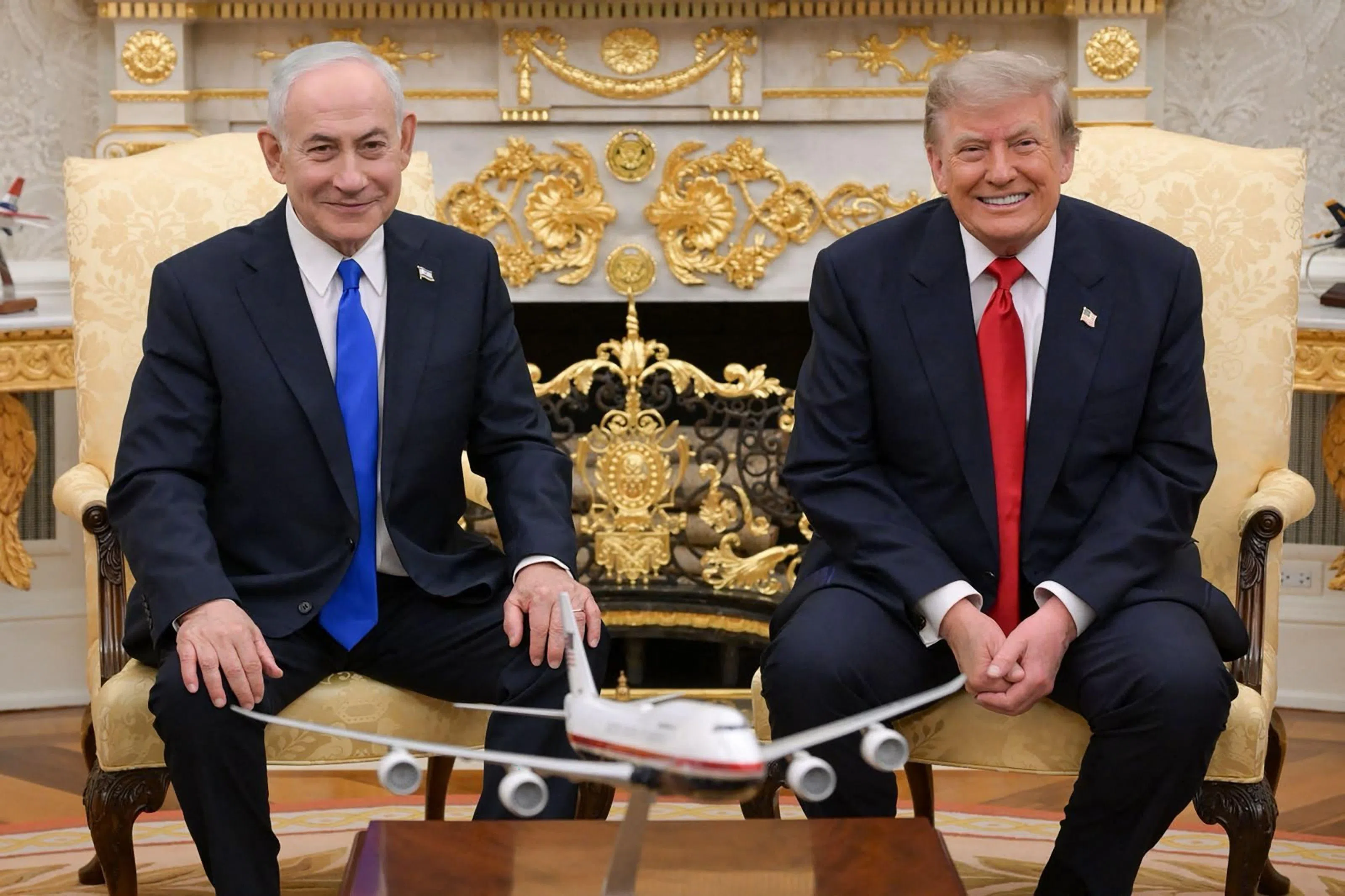 A photo released by the Israeli Government Press Office shows Israeli Prime Minister Benjamin Netanyahu (left) in the Oval Office on July 28 with US President Donald Trump.