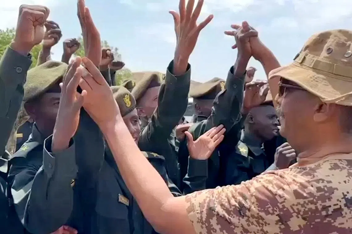 Head of Sudan's armed forces Abdel Fattah al-Burhan greets army officers after a drone strike hit an army base where he attended a graduation ceremony, in Gebit, Sudan, July 31, 2024, in this still image obtained from a video. Sudanese Sovereign Council Media Office/Handout via REUTERS
