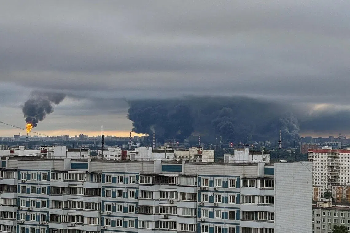Thick plumes of smoke with flames rise from an oil refinery following a Ukrainian drone strike in Moscow, Russia, on June 18, 2026.