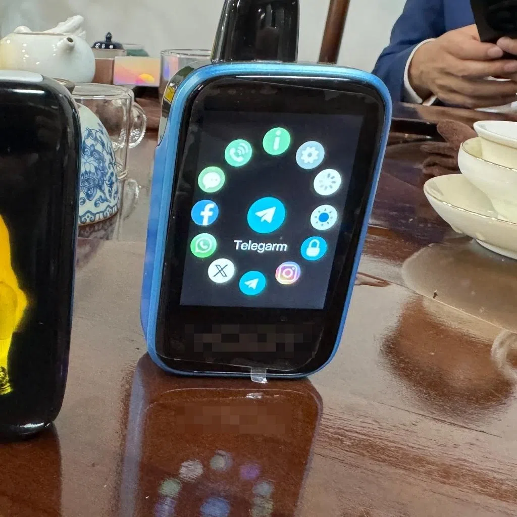 Vape factory owner Mr Li shows off tech-enabled vapes that allow users to connect to their smartphones via Bluetooth to listen to music and browse apps such as Instagram and Telegram.