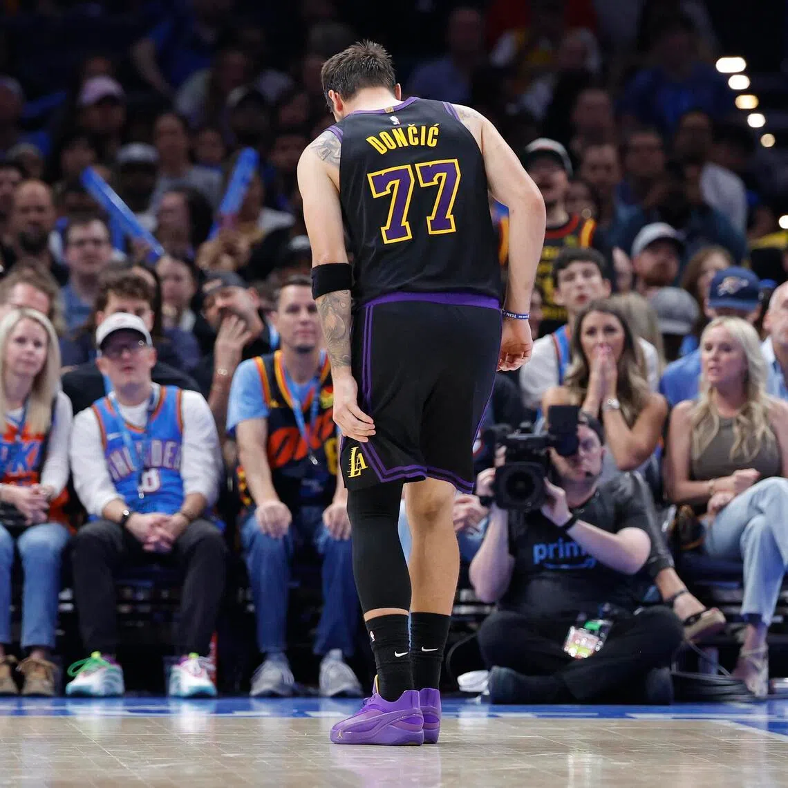 Apr 2, 2026; Oklahoma City, Oklahoma, USA; Los Angeles Lakers guard Luka Doncic hopping to the side of the court during a play against the Oklahoma City Thunder in the second half at Paycom Center on April 2, 2026. Doncic limped out midway through the third quarter of the 139-96 NBA loss with a left hamstring injury.