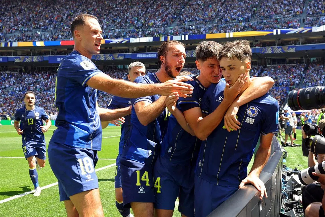 Soccer Football - FIFA World Cup 2026 - Group B - Bosnia and Herzegovina v Qatar - Seattle Stadium, Seattle, Washington, U.S. - June 24, 2026 Bosnia and Herzegovina's Kerim Alajbegovic celebrates scoring their first goal with teammates REUTERS/Carlos Barria