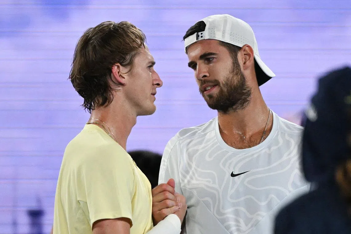 Russia's Karen Khachanov (right) speaks with USA's Sebastian Korda after their quarter-final match on Jan 24, 2023.