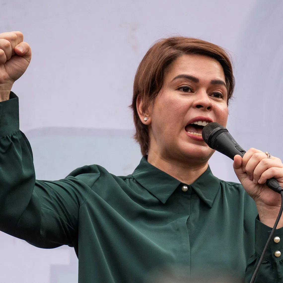 FILE PHOTO: Philippine Vice President Sara Duterte gestures as she speaks to supporters on stage after the postponement of her arraignment, outside the Quezon City Hall in Quezon City, Philippines, September 11, 2026. REUTERS/Lisa Marie David/ File Photo