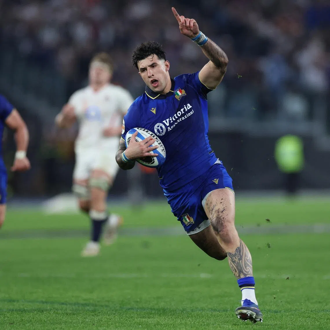 Rugby Union - Six Nations Championship - Italy v England - Stadio Olimpico, Rome, Italy - March 7, 2026 Italy's Tommaso Menoncello in action before scoring a try REUTERS/Ciro De Luca