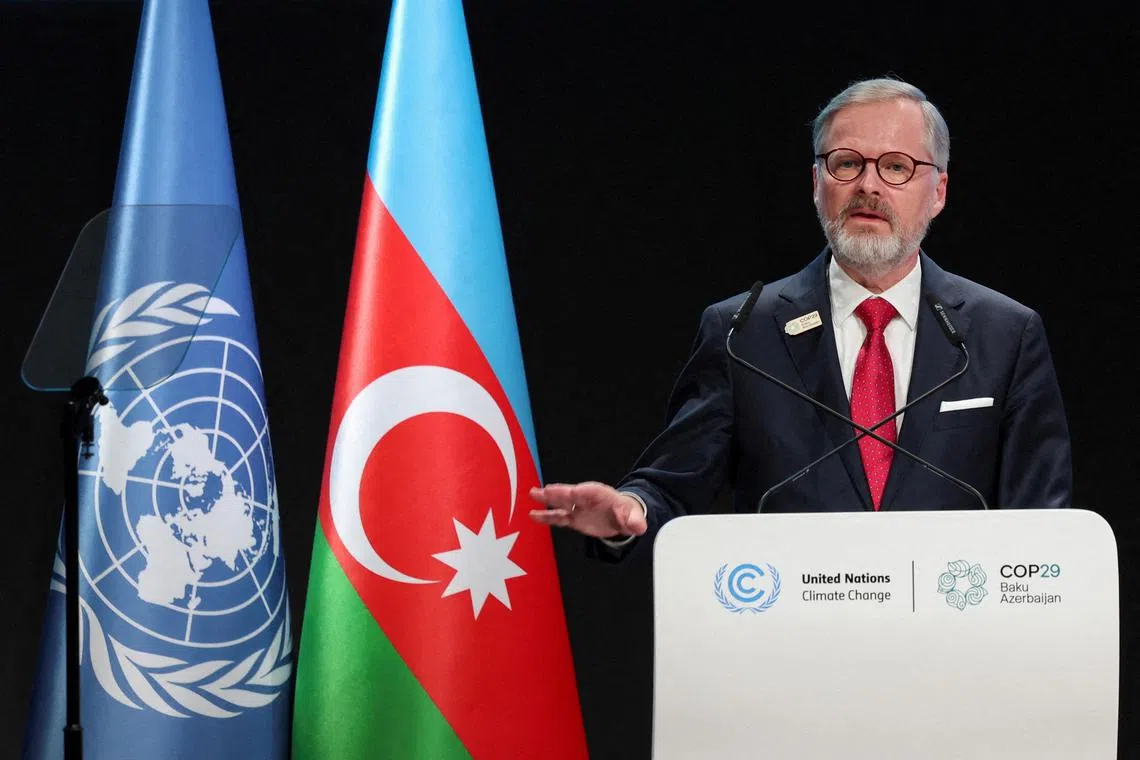 FILE PHOTO: Czech Republic's Prime Minister, Petr Fiala, speaks during the United Nations climate change conference COP29, in Baku, Azerbaijan November 13, 2024. REUTERS/Murad Sezer/File Photo