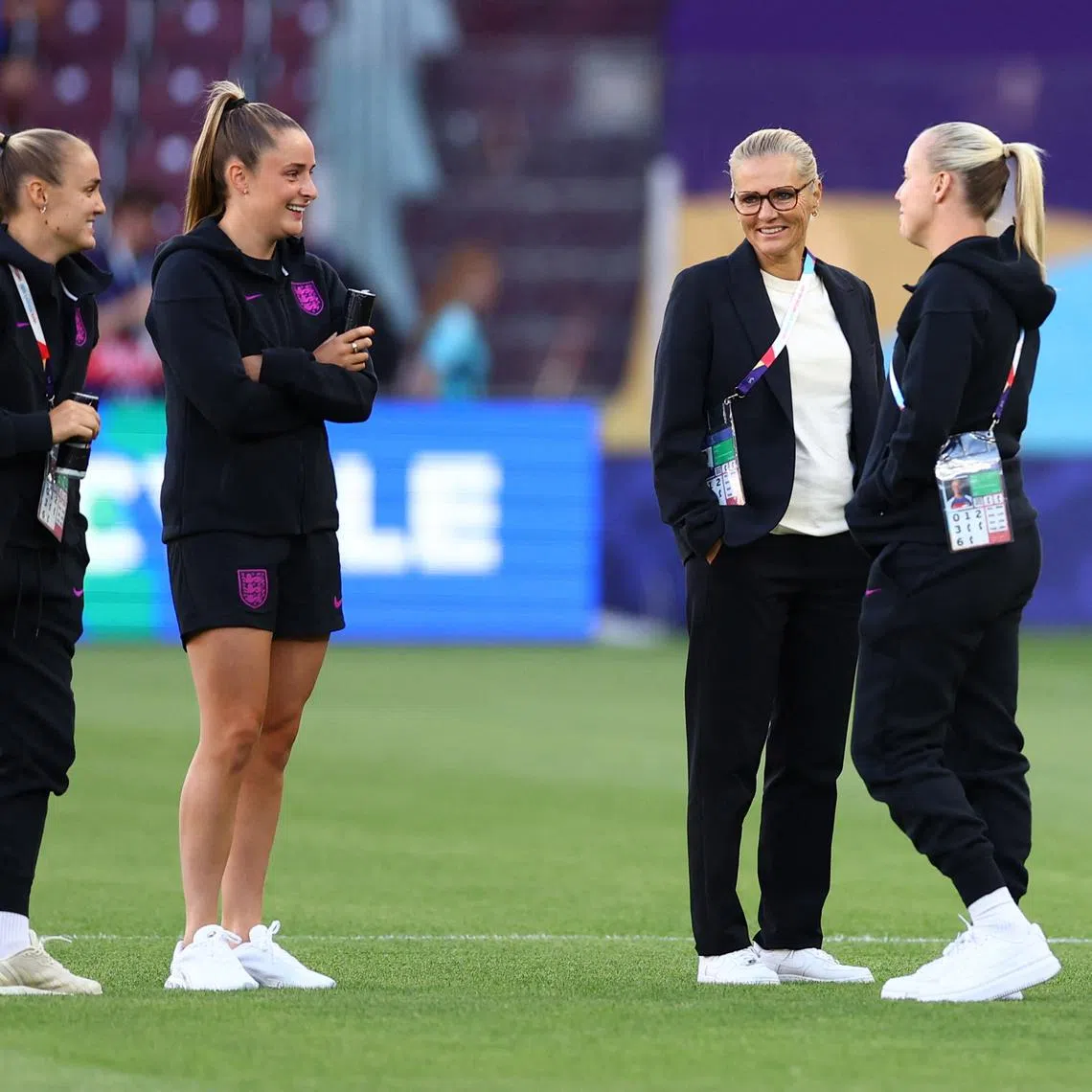 FILE PHOTO: Soccer Football - UEFA Women's Euro 2025 - Semi Final - England v Italy - Stade de Geneve, Lancy, Switzerland - July 22, 2025 England manager Sarina Wiegman, England's Ella Toone, England's Georgia Stanway and England's Beth Mead on the pitch before the match REUTERS/Piroschka Van De Wouw/File Photo