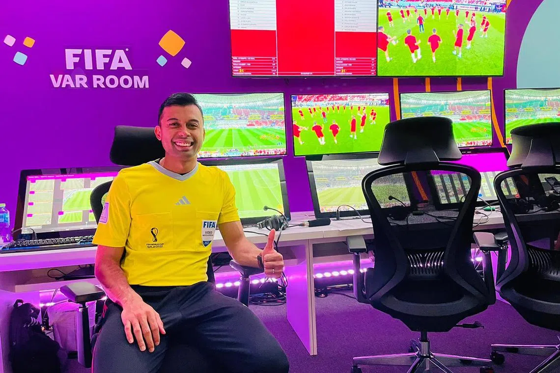 szref19 - Singaporean referee Taqi Jahari in the video assistant referee (VAR) room ahead of the Spain v Costa Rica match on Nov 23.

Credit: Taqi Jahari
For SPH use with credit