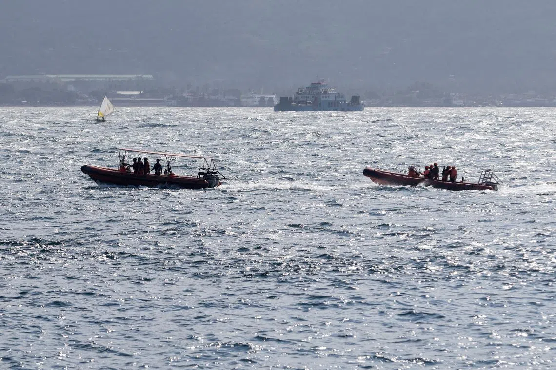 Indonesia rescue team members sail on dinghies during a search operation for missing passengers, after the KMP Tunu Pratama Jaya ferry carrying 65 people sank near the Indonesian island of Bali, in Bali, Indonesia, July 3, 2025. REUTERS/Johannes P. Christo