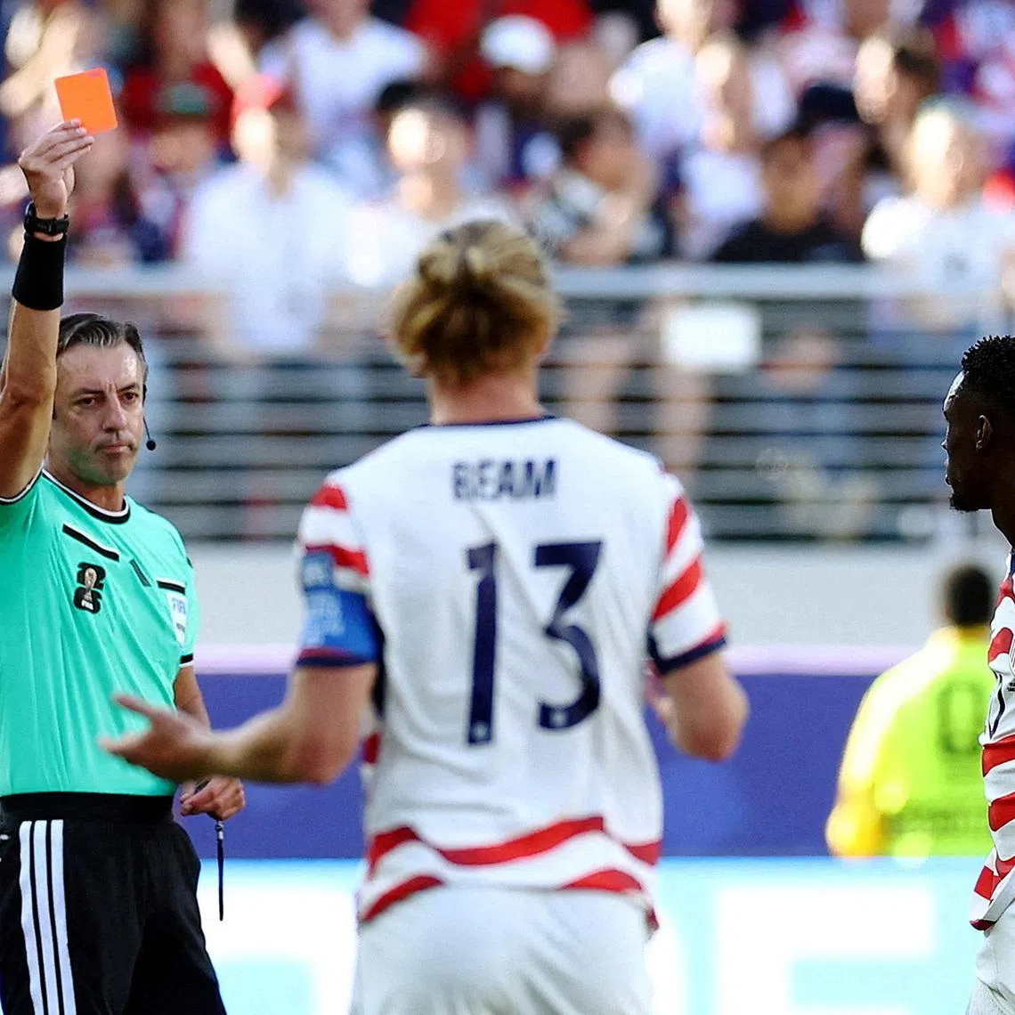 FILE PHOTO: Soccer Football - FIFA World Cup 2026 - Round of 32 - United States v Bosnia and Herzegovina - San Francisco Bay Area Stadium, Santa Clara, California, U.S. - July 1, 2026 Folarin Balogun of the U.S. is shown a red card by referee Raphael Claus REUTERS/Phil Noble/File Photo