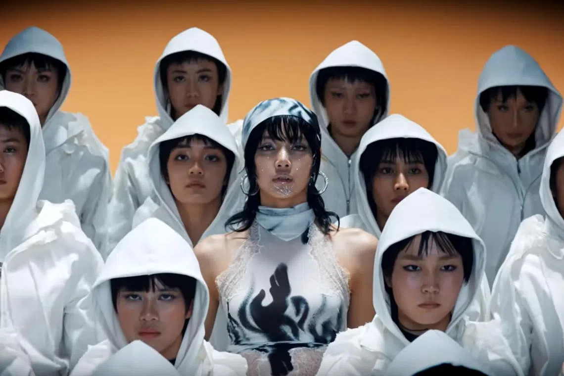 Lisa (centrE) and Thai dancers are seen in the music video of her new solo single Rockstar.