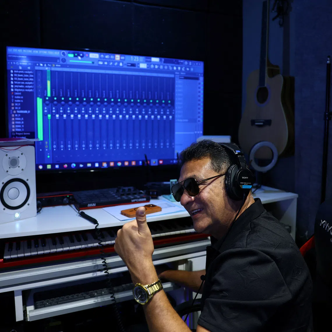 MC Bob Rum, who wrote the original 1995 song \"Rap do Silva,\" which was adapted in July 2026 as a campaign jingle highlighting the working-class roots of President Luiz Inacio Lula da Silva during his presidential campaign, gestures while listening to a music during an interview with Reuters at his studio in Rio de Janeiro, Brazil, August 10, 2026. REUTERS/Pilar Olivares
