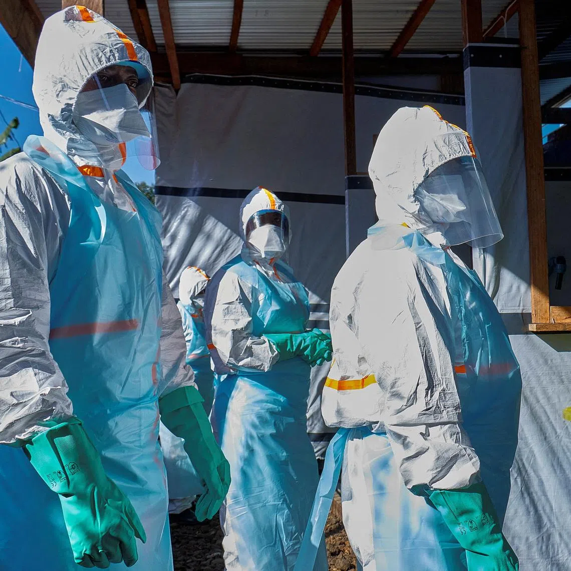 Health workers dress up in personal protective equipment (PPE) at the Evangelical Medical Center, one of the facilities at the forefront of the response to the Ebola outbreak, as agencies intensify efforts to contain a new Ebola outbreak caused by the Bundibugyo virus strain, in Bunia, Ituri province, Democratic Republic of Congo, May 31, 2026. REUTERS/Gradel Muyisa Mumbere