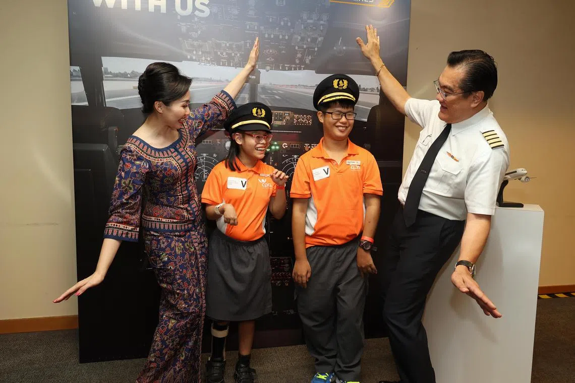 CMG20230923-ThongKH01唐家鸿/黄银川/Singapore Airlines to help raise $2.6 million for charities as part of SIA Cares week [SIA Training Centre, 720 Upp Changi Road East, S'486852]
黄银川/0923银川本地新航关爱开放日

SIA has raised $2.6 million for Cerebral Palsy Alliance Singapore (CPAS) and SPD (formerly Society for the Physically Disabled) as part of its inaugural SIA Cares week. SIA’s partners, members of the public, and staff contributed $1.3 million through cash donations, by purchasing items that were designed by selected beneficiaries, and by sponsoring tours at a special SIA Cares open house at the SIA Training Centre. The Airline matched this amount dollar for dollar with an additional $1.3 million.

From 9am to 5pm on 23 September 2023, SIA will also host more than 400 participants from 30 Singapore-based social service agencies for a behind-the-scenes tour of our SIA Training Centre. Tour participants will also get the opportunity to interact with SIA’s pilots, cabin crew, and ground staff. They will also enjoy a selection of SIA’s popular in-flight meals after the tour. This is the culmination of SIA’s inaugural SIA Cares week, which saw almost 900 SIA staff volunteers from 53 cities participate in community activities that support a myriad of causes.

- Profile for ZB:
- Pilot 范景华, 55 (right). 
- Cabin Crew 郭亦雯, 31 (left)
The two beneficiaries fr CPAS.