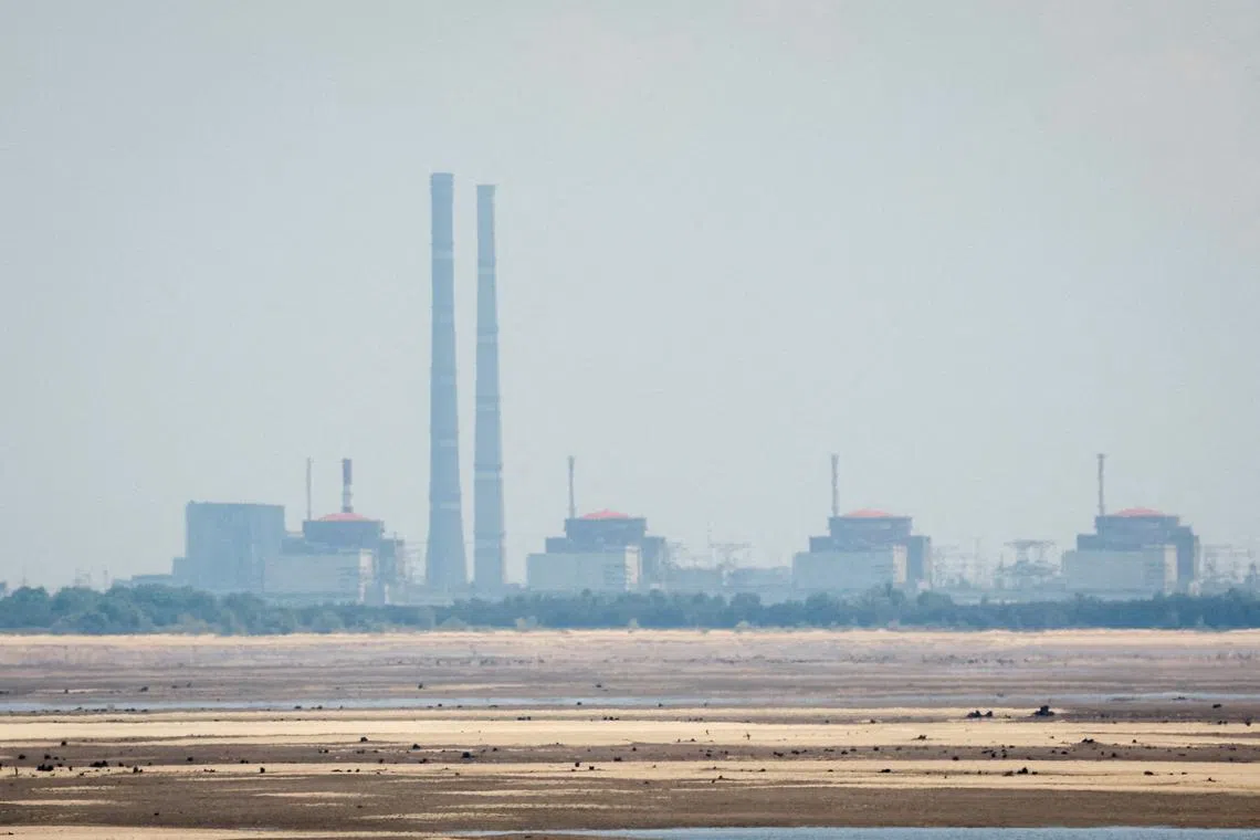 FILE PHOTO: A view shows Zaporizhzhia Nuclear Power Plant from the bank of Kakhovka Reservoir near the town of Nikopol after the Nova Kakhovka dam breached, amid Russia's attack on Ukraine, in Dnipropetrovsk region, Ukraine June 16, 2023. REUTERS/Alina Smutko/File Photo