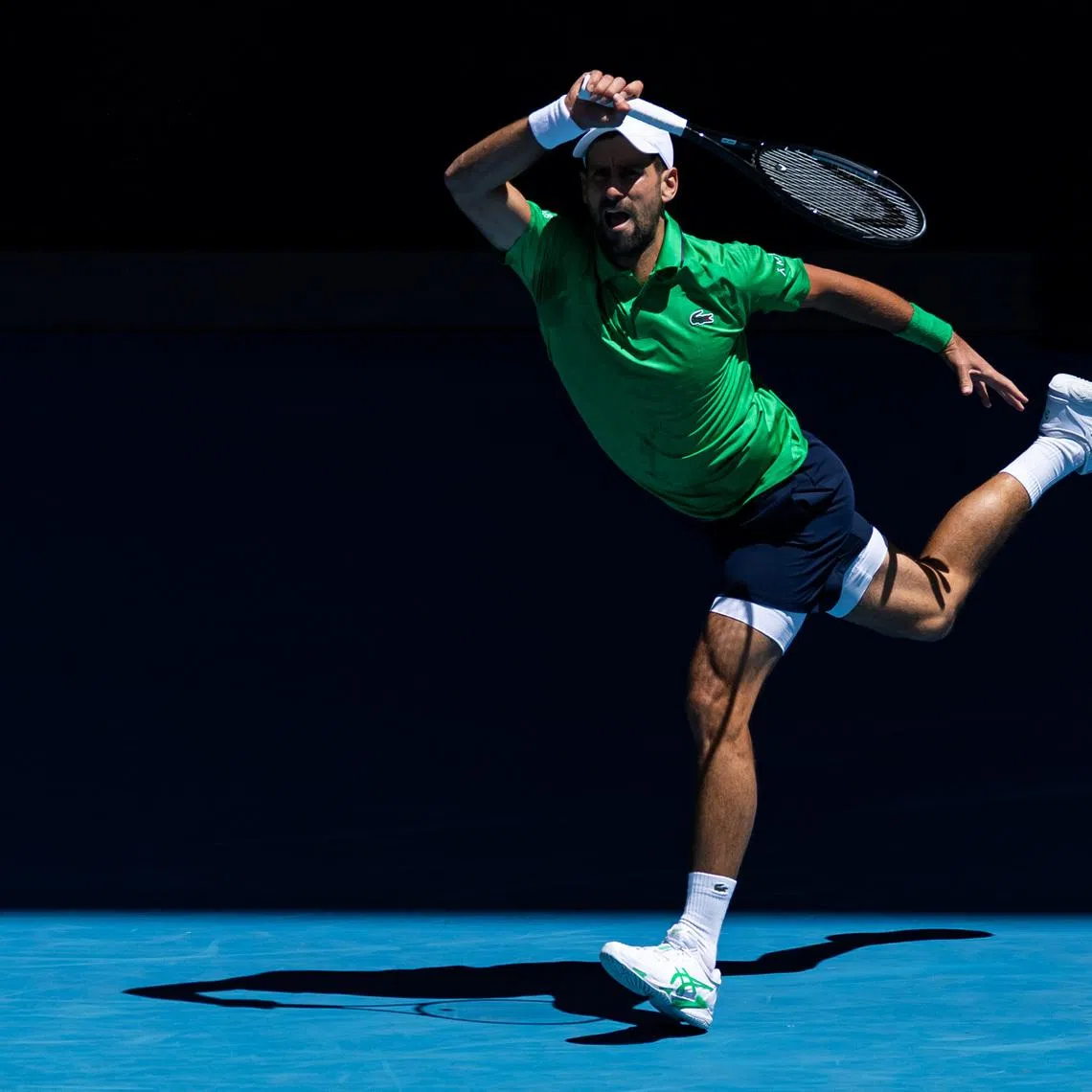 Jan 22, 2026; Melbourne, Victoria, Australia; Novak Djokovic of Serbia in action against Francesco Maestrelli of Italy in the second round of the men’s singles at the Australian Open at Rod Laver Arena in Melbourne Park. Mandatory Credit: Mike Frey-Imagn Images