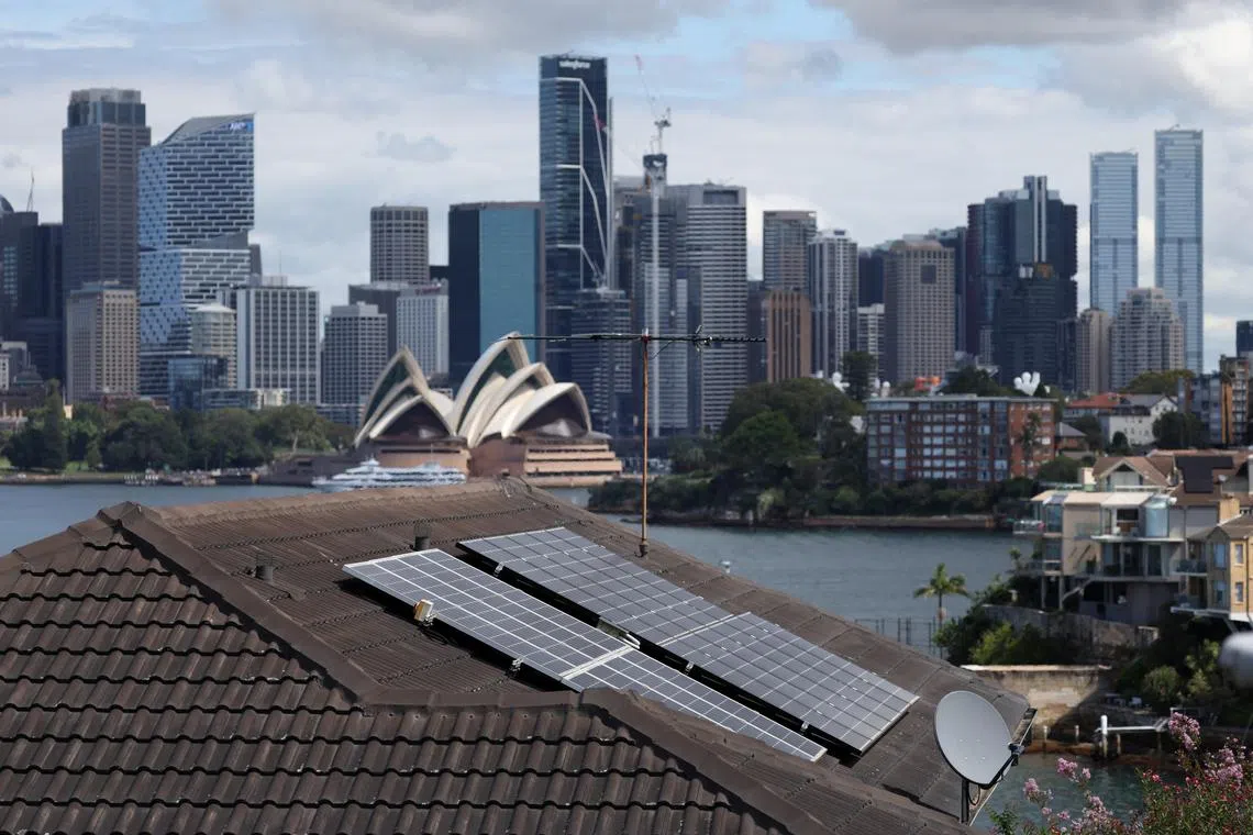 Solar panels are seen on the roof of a residential property in Sydney, Australia, March 12, 2025. REUTERS/Hollie Adams