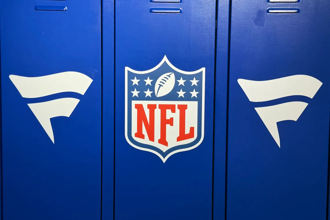 Oct 2, 2026; London, United Kingdom; The NFL shield and Fanatics logos at a locker room display at the NFL Shop on Oxford Street. Mandatory Credit: Kirby Lee-Imagn Images