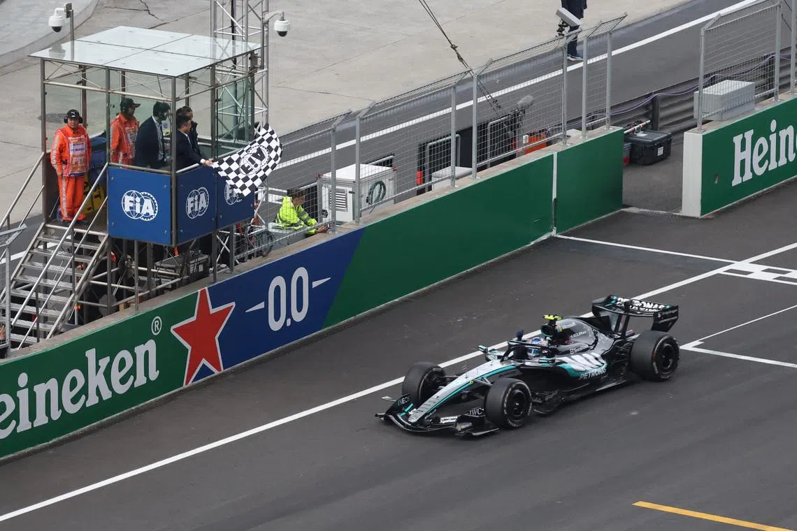 Formula One F1 - Chinese Grand Prix - Shanghai International Circuit, Shanghai, China - March 15, 2026 Mercedes' Andrea Kimi Antonelli passes the chequered flag to win the Chinese Grand Prix REUTERS/Maxim Shemetov