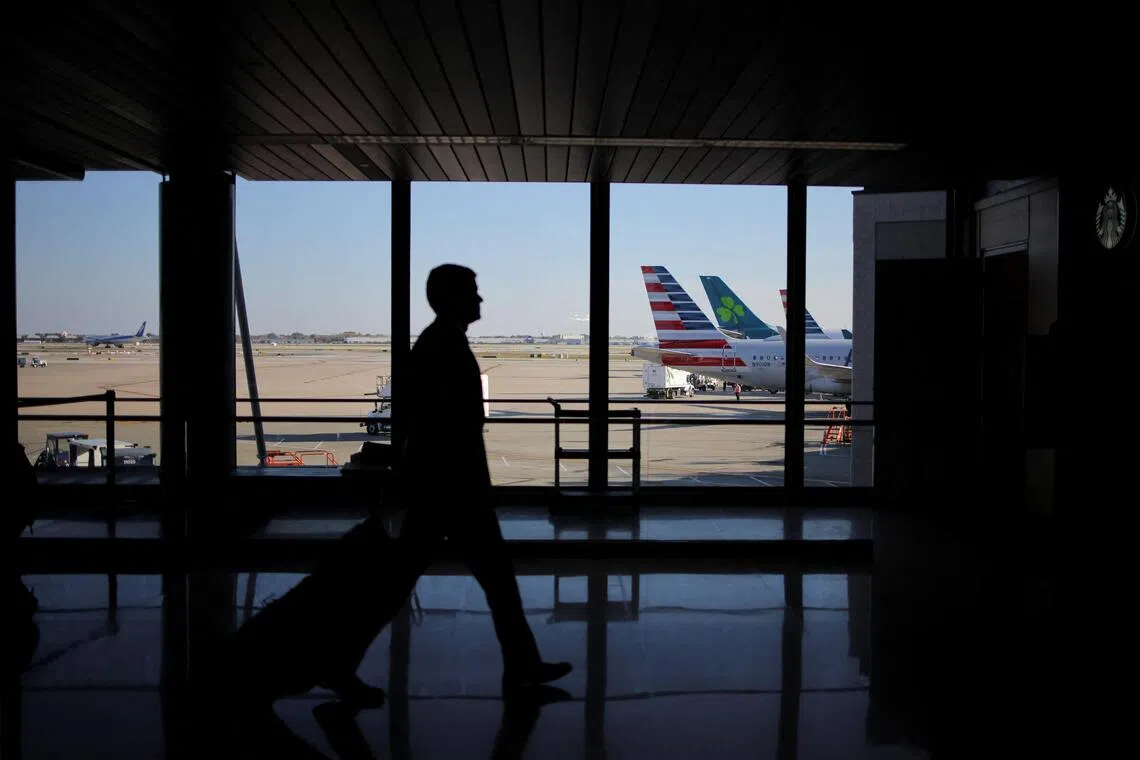 A traveller walks through Chicago O'Hare International Airport as the US. government shutdown continues.