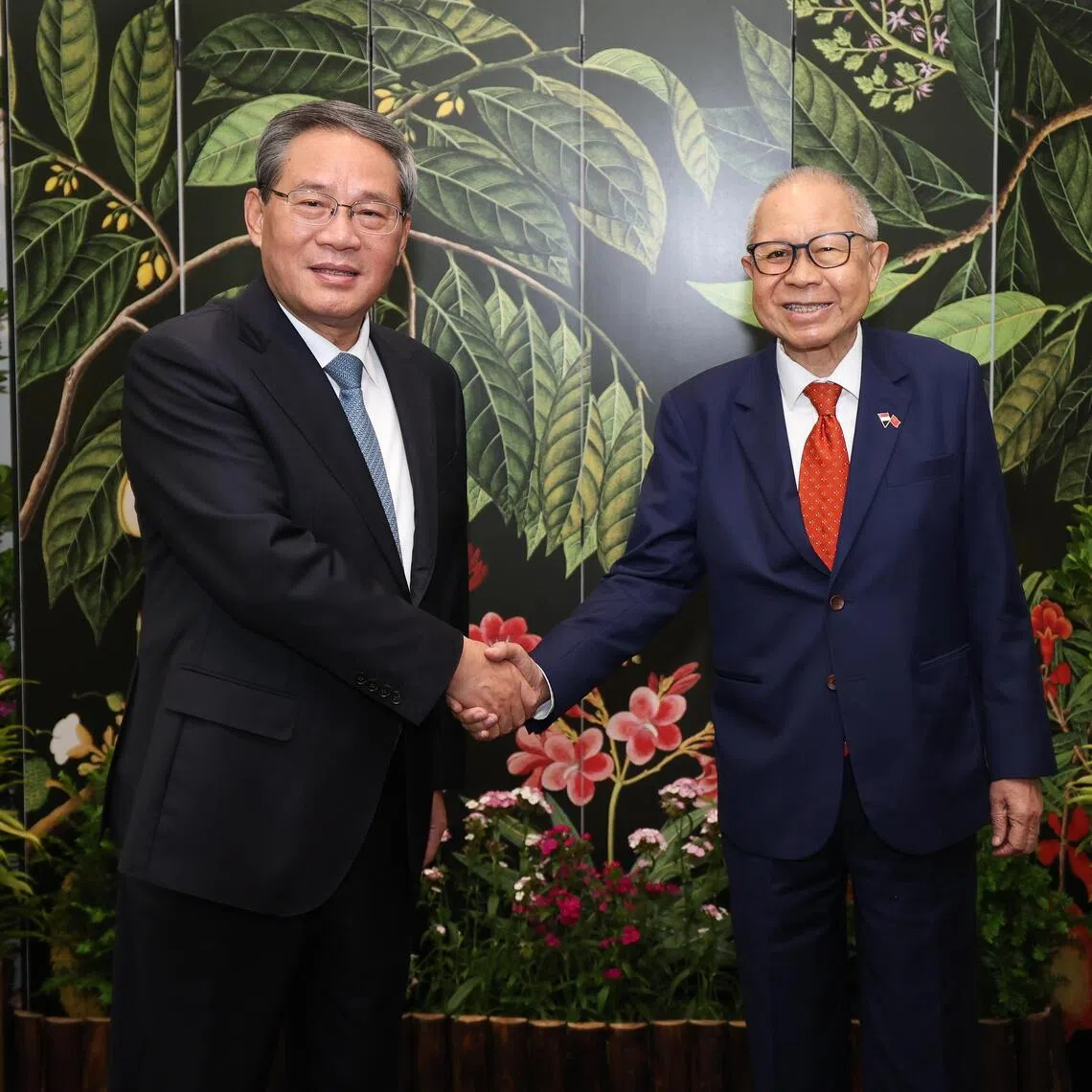 Chinese Premier Li Qiang (left) calling on Acting President Eddie Teo at the Istana on Oct 26.