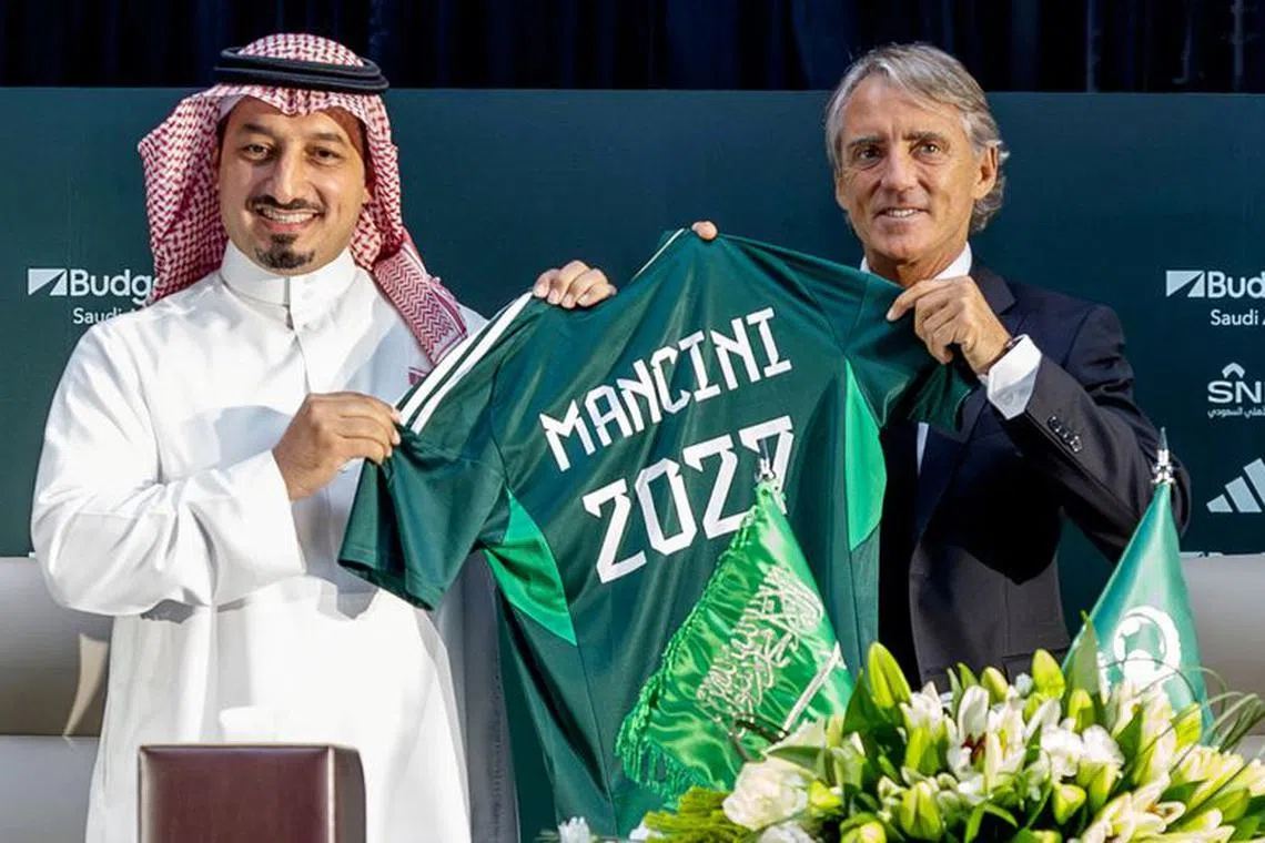 Soccer Football - Roberto Mancini signs as Saudi Arabia Coach - Fairmont Hotel, Riyadh, Saudi Arabia - August 28, 2023 New Saudi Arabia coach Roberto Mancini poses with Yasser Al-Misehal president of Saudi Arabia Football Federation during a press conference Saudi Arabia Football Federation/Handout via REUTERS