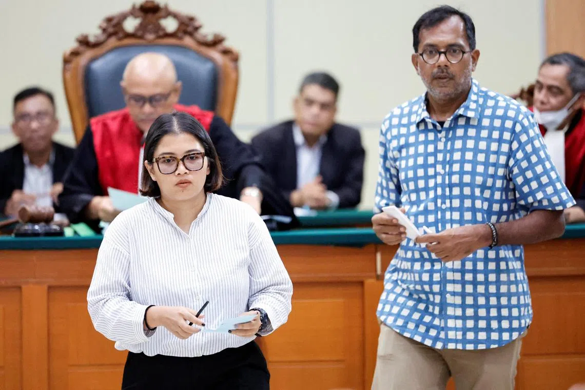 Indonesian activists Fatia Maulidiyanti (left) and Haris Azhar receiving their verdict in court on Jan 8, 2023.