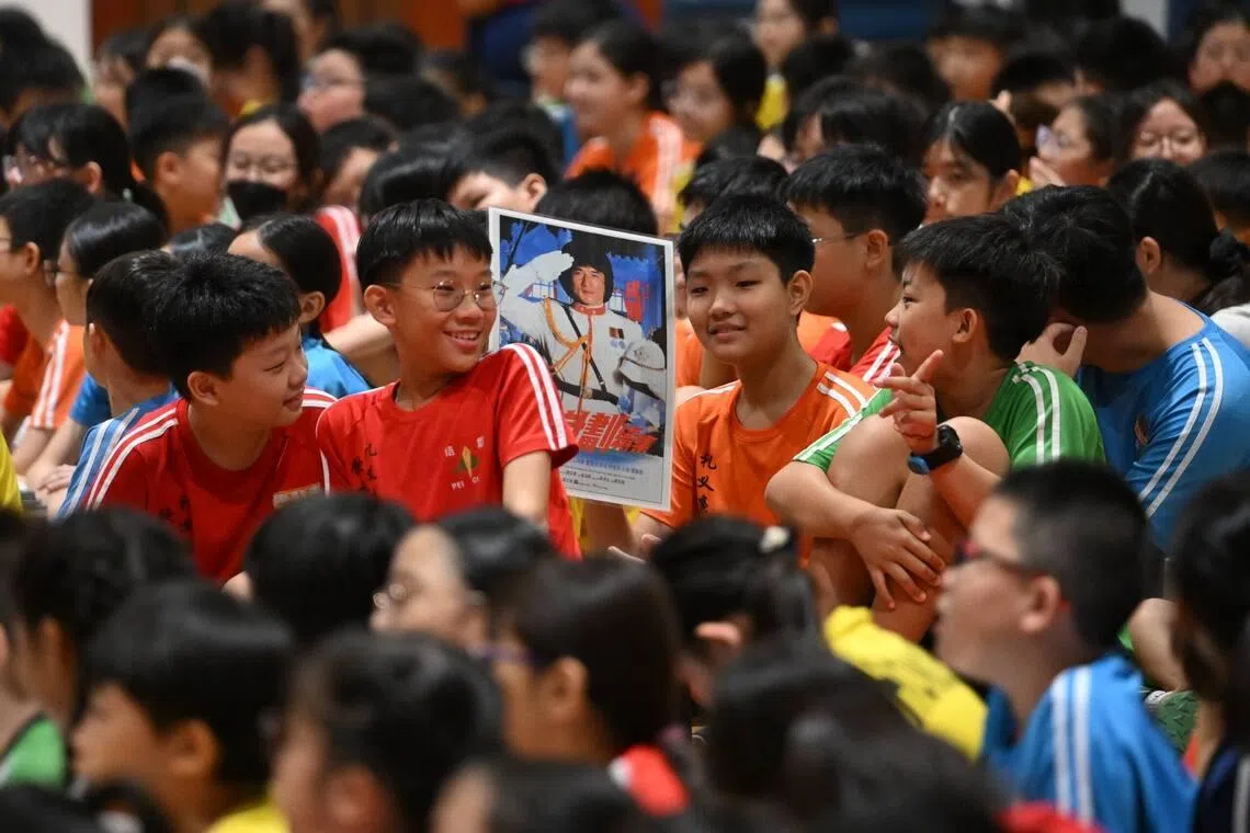 Image 2: A Pei Chun Public School student holding a poster of Jackie Chan on .