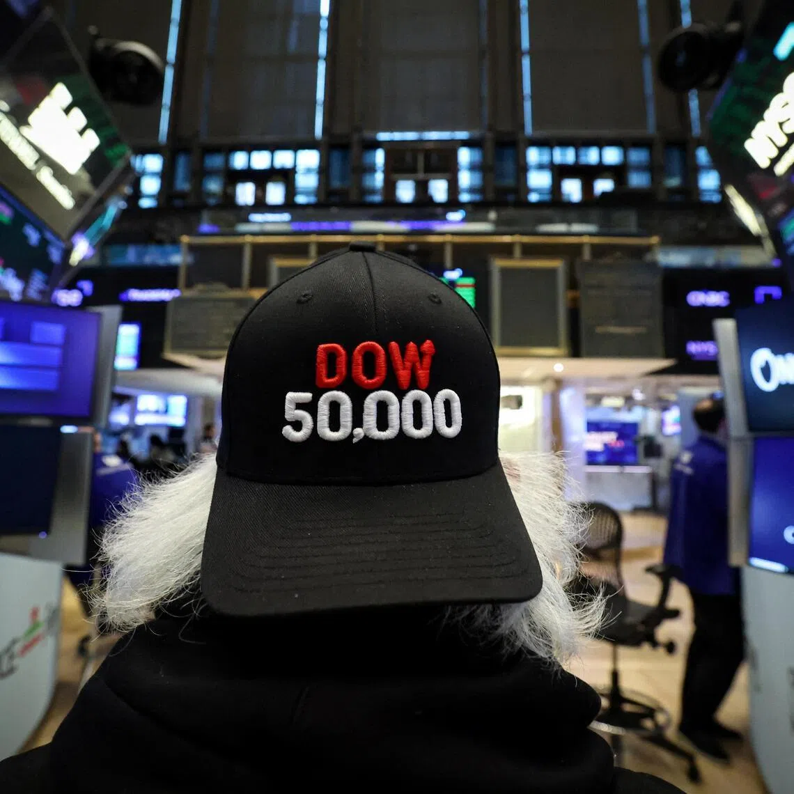 Traders working on the floor of the New York Stock Exchange, in New York City, as the Dow Jones Industrial Average surpasses the 50,000 mark.