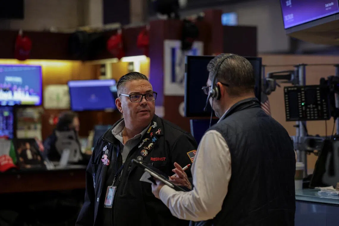 Traders working on the floor of the New York Stock Exchange, in New York City, on Nov 14.