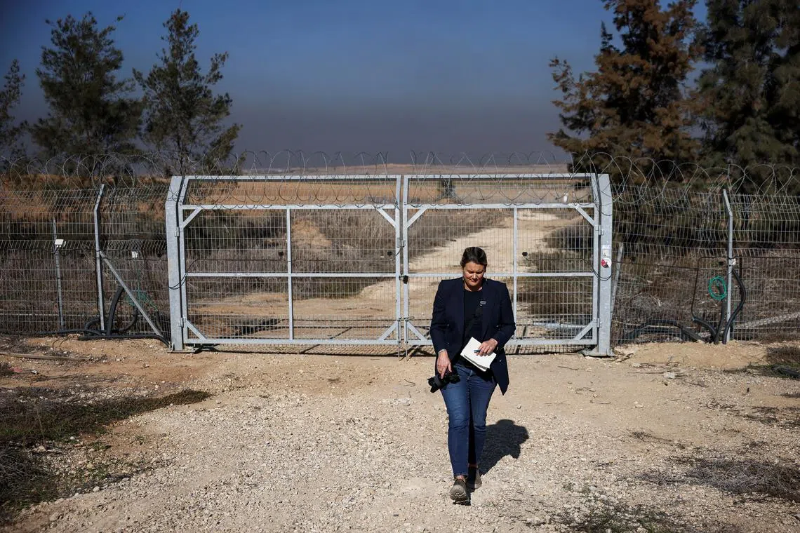 Dr Alice Jill Edwards, the UN Special Rapporteur on Torture, walks in front of a gate of Kibbutz Kfar Aza, one of the Israeli communities ravaged during the deadly October 7, 2023 attack by Hamas, as she visits Kibbutz Kfar Aza, in southern Israel, December 18, 2024. REUTERS/Stoyan Nenov