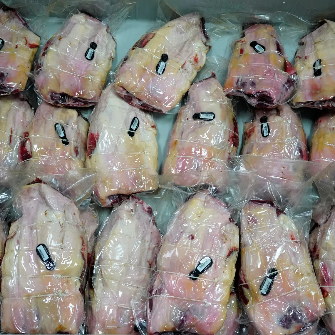 Spanish hams vacuum packed are seen at a factory in Guijuelo, Spain, April 14, 2020. REUTERS/Juan Medina/File Photo