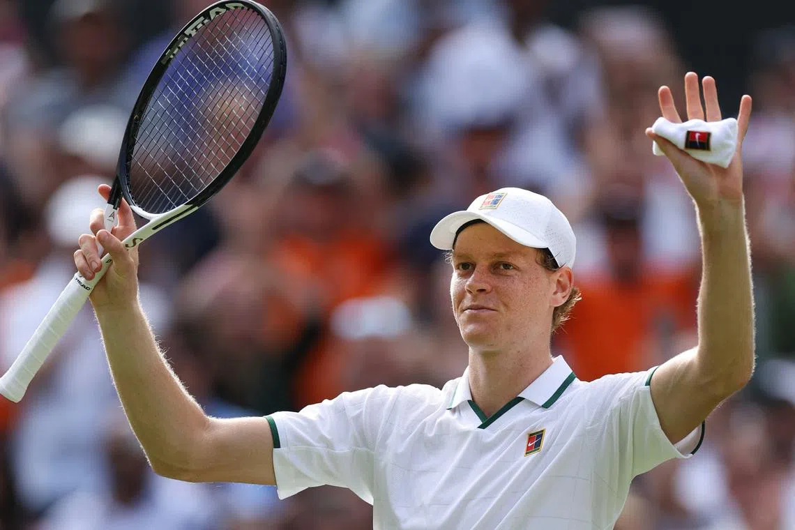 Jannik Sinner celebrates after winning his first-round match against Serbia’s Miomir Kecmanovic at Wimbledon on June 29.