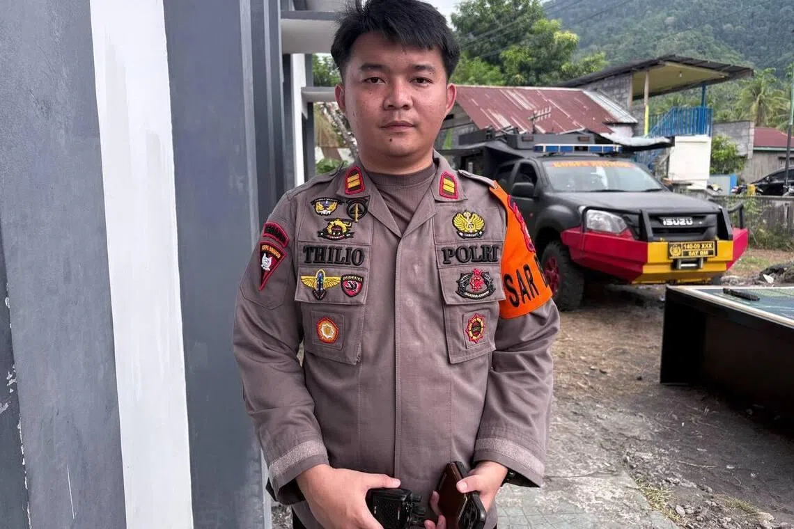 Mr Mochamad Thilio, a police officer with the Tobelo Mobile Brigade (Brimob), who is coordinating communications with the search and rescue team in Mamuya village, Galela, North Halmahera, North Maluku, Indonesia.