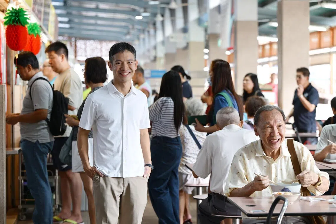 Jalan Besar GRC MP Shawn Loh edits his speeches on the fly as others bring up their points.