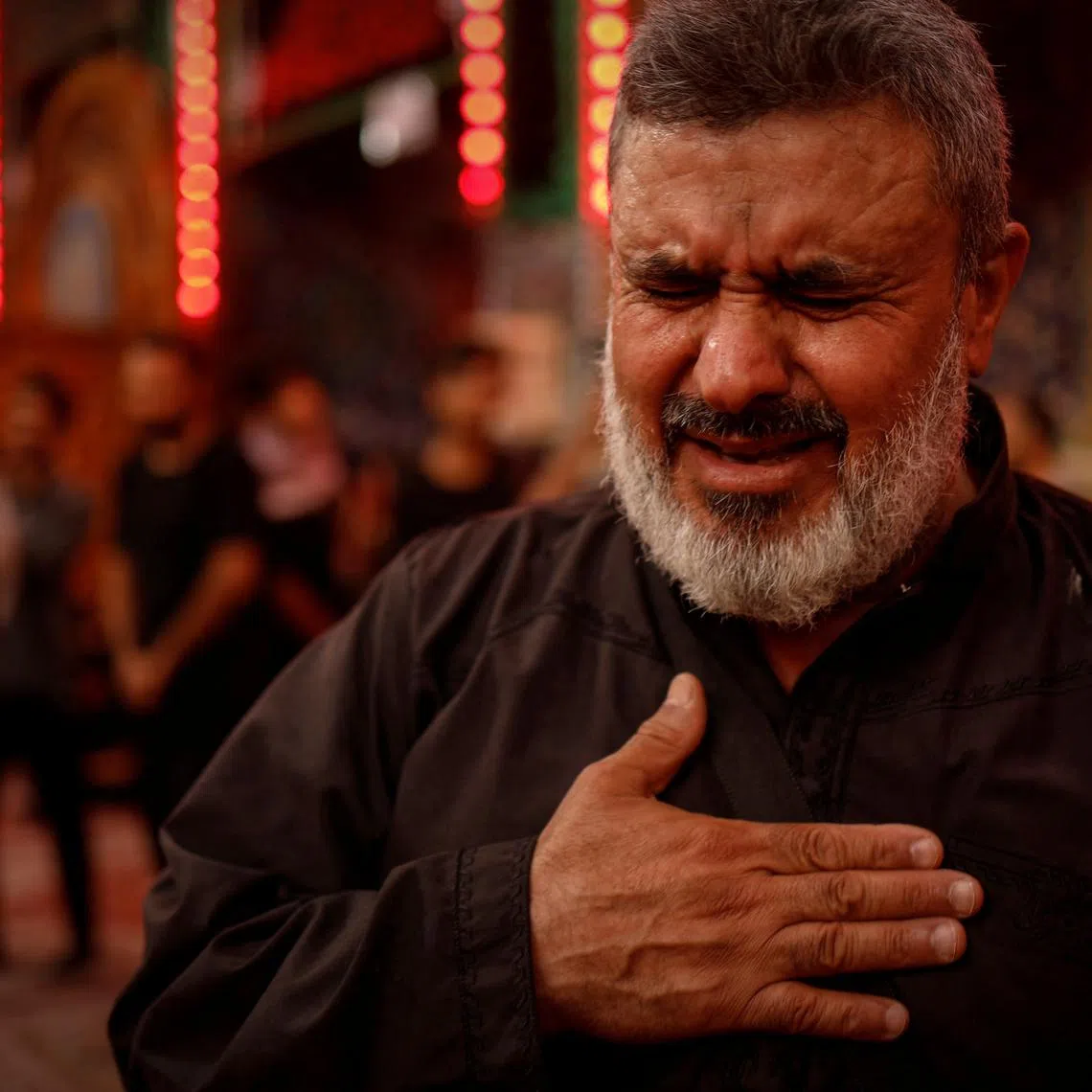 Majid al-Kareem, 58, reacts at the Imam Hussein Shrine, ahead of the Shi'ite holy ritual of Arbaeen, in the holy city of Karbala, Iraq August 11, 2025. REUTERS/Alaa al-Marjani