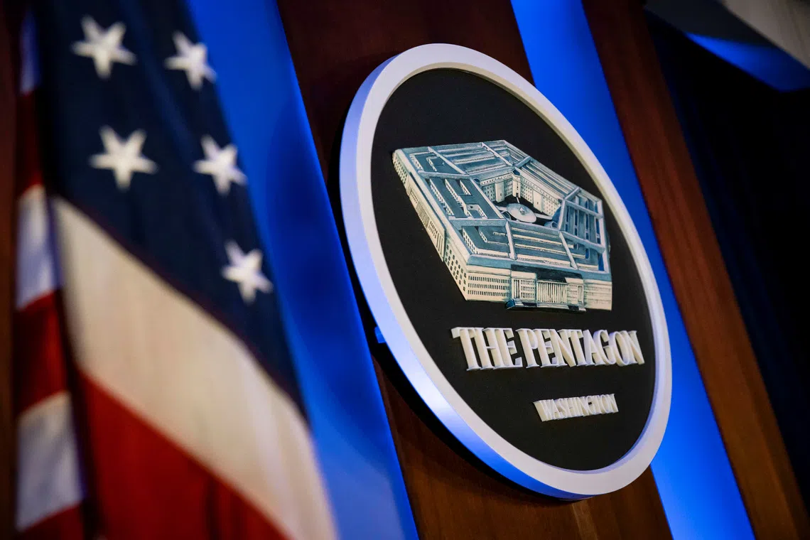 FILE PHOTO: The Pentagon logo is seen behind the podium in the briefing room at the Pentagon in Arlington, Virginia, U.S., January 8, 2020. REUTERS/Al Drago/ File Photo