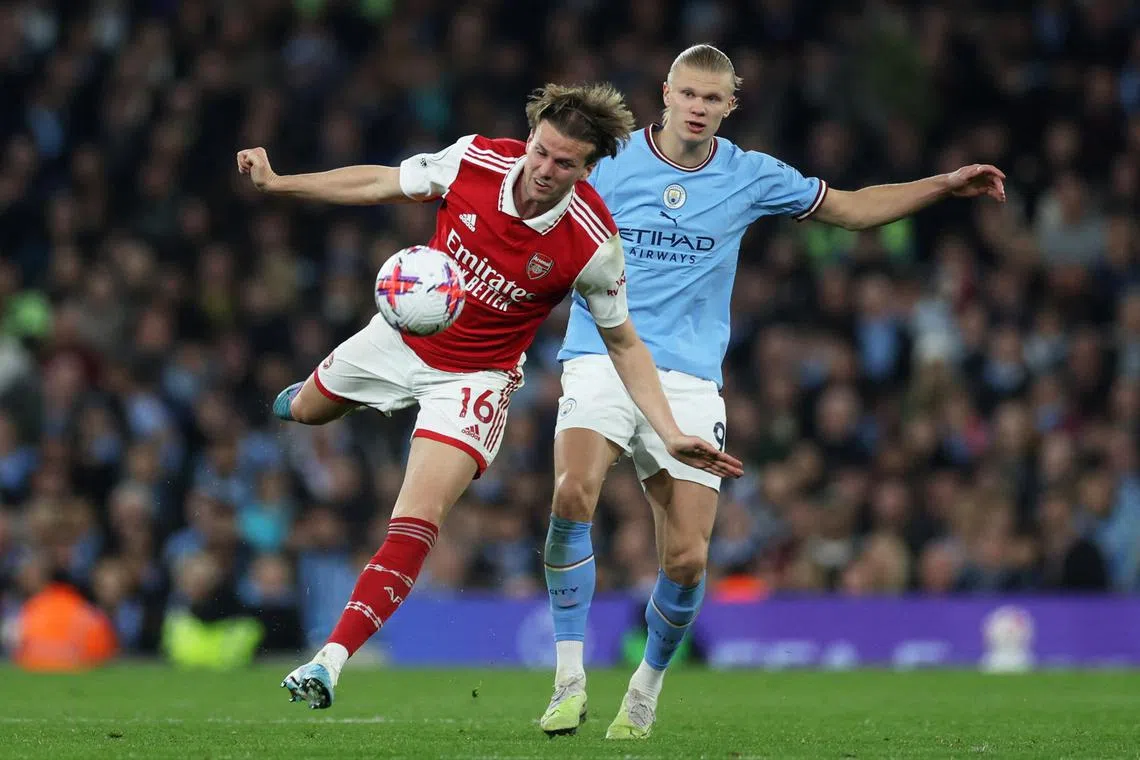 Arsenal's Rob Holding in action with Manchester City's Erling Braut Haaland. Holding scored the team's only goal in their 4-1 loss to their title rivals on Wednesday.