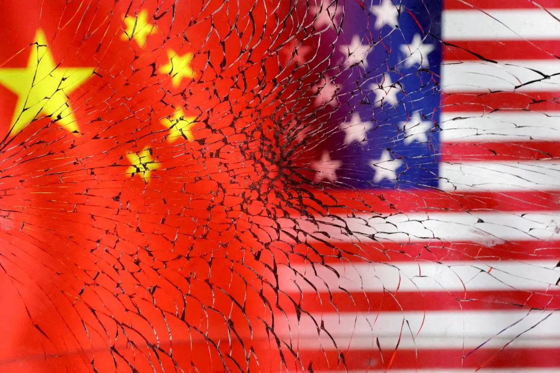 FILE PHOTO: U.S. and Chinese flags are seen through broken glass in this illustration taken Jan. 30, 2023. REUTERS/Dado Ruvic/Illustration/File Photo
