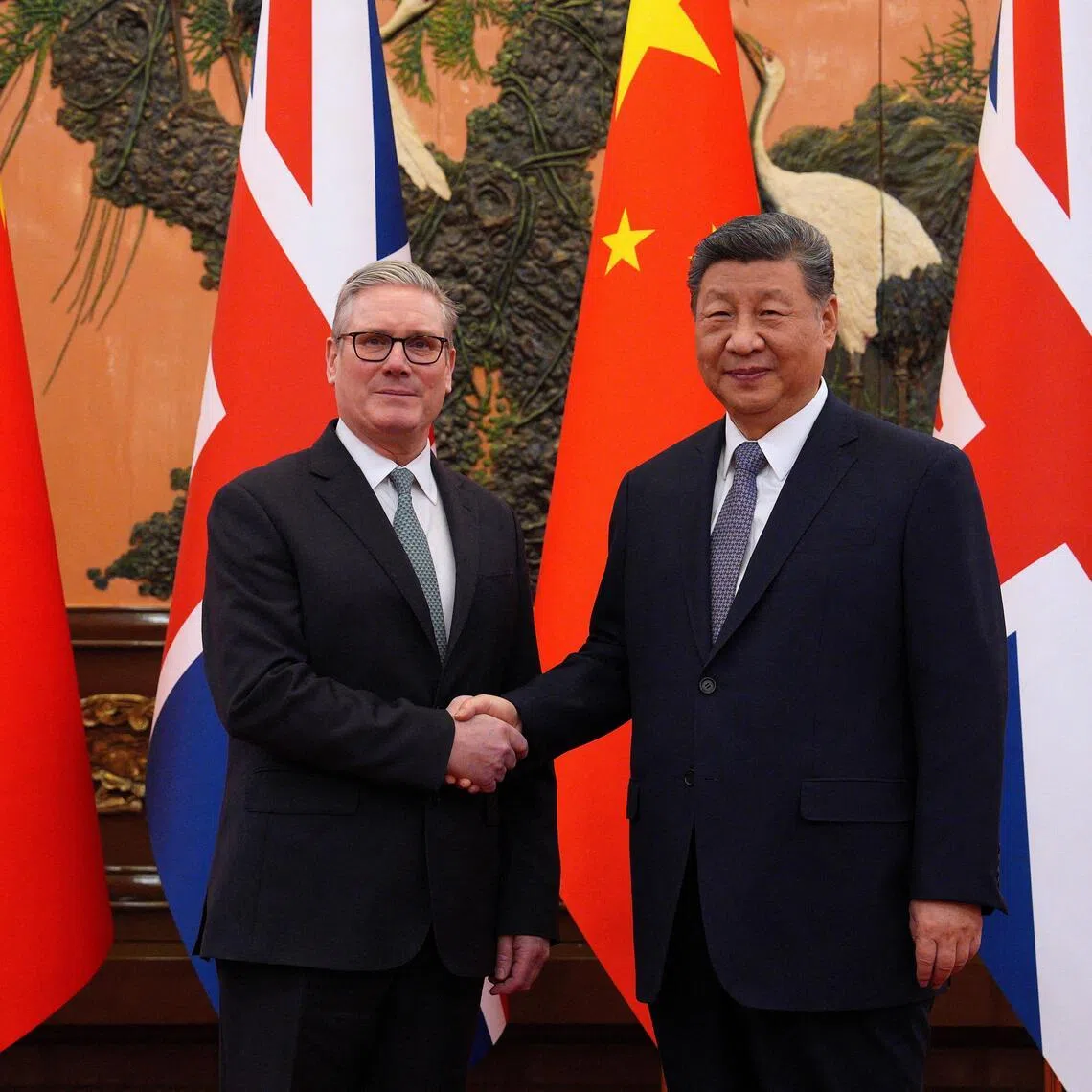 Britain's Prime Minister Keir Starmer (left) called for a “more sophisticated relationship” with Chinese President Xi Jinping.